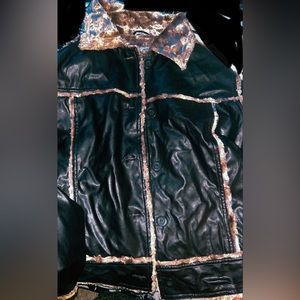 I'm selling a dark brown leather jacket with fluffy light brown lines. size M